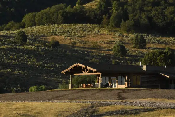 Public vs private land hunting success rates - Secluded hunting lodge at West Canyon Ranch surrounded by Utah wilderness, representing private land exclusivity and premium hunting experiences.